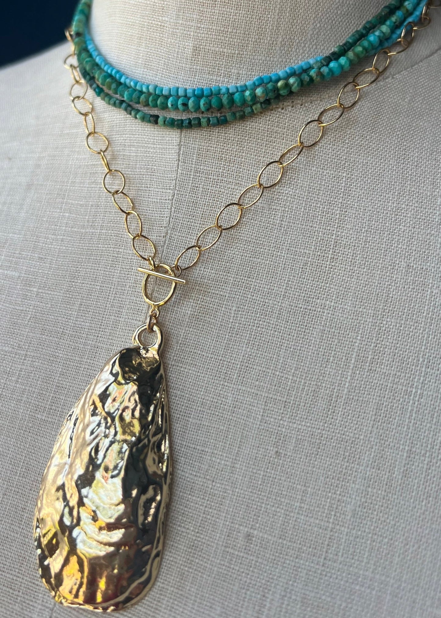 large gold oyster pendant